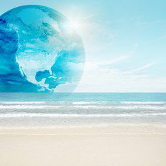 America globe on tropical beach. Map from NASA imagery