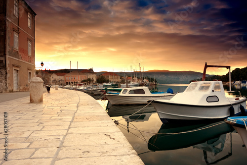 empty quay of mediterranean town Starji Grad at sunset