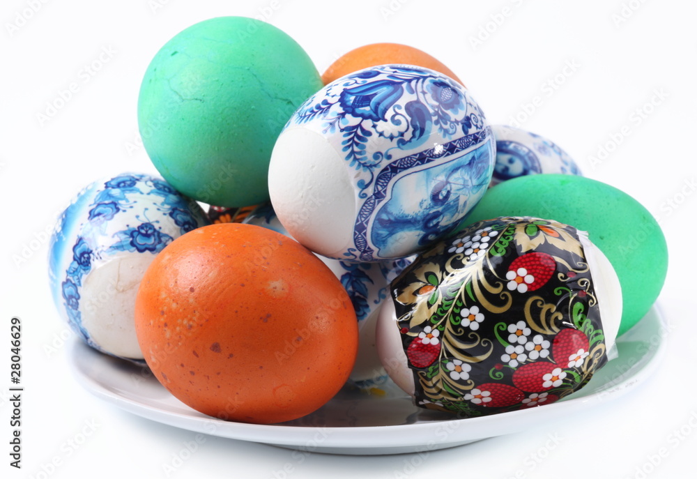 Fototapeta premium Multi-colored eggs on a plate. Easter holiday