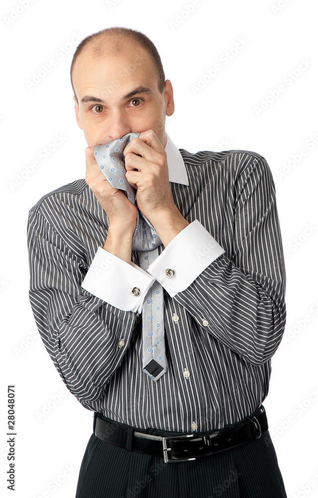 Worried business man holding his hands to mouth Worried business man holding his hands to mouth