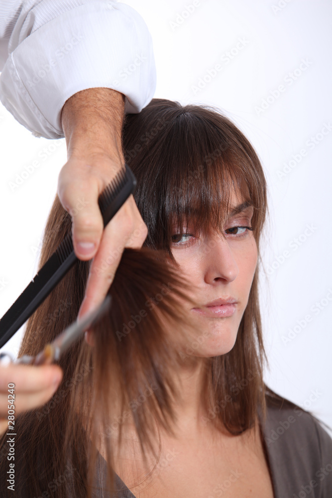 Fototapeta premium Closeup of woman having an haircut