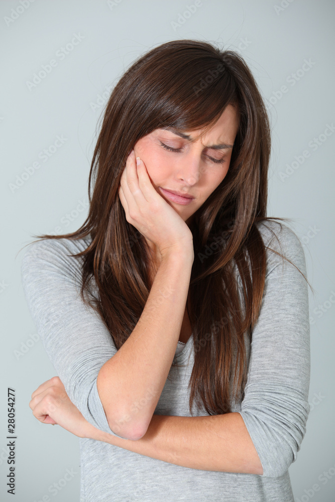 Closeup of young woman having a toothache Closeup of young woman having a toothache