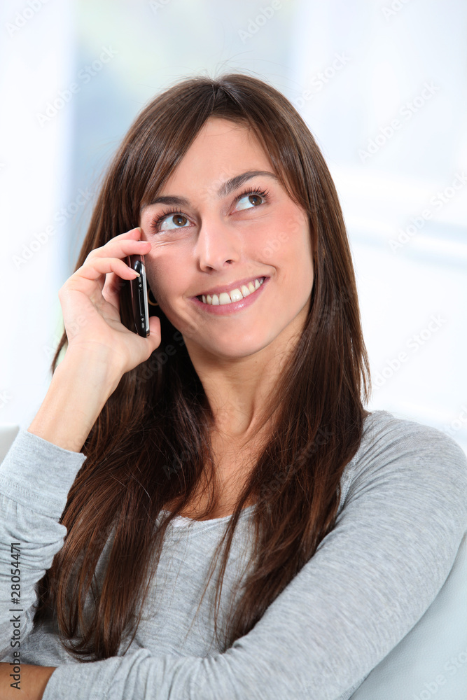 Beautiful young woman talking on mobile phone Beautiful young woman talking on mobile phone