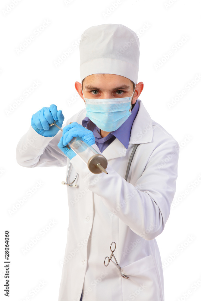 Portrait of the doctor in a mask with the big syringe isolated o Portrait of the doctor in a mask with the big syringe isolated o