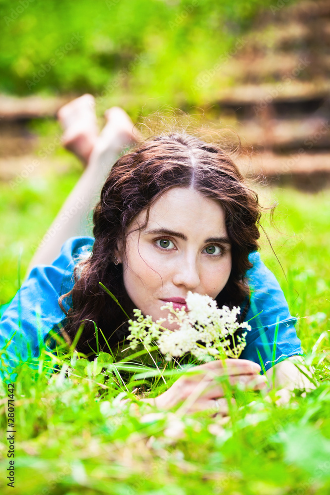 Lying pretty smiling girl in blue Lying pretty smiling girl in blue