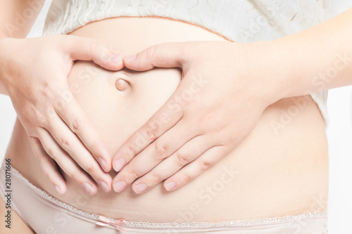 Wallpaper Mural Pregnant caucasian mother with hands on belly Torontodigital.ca