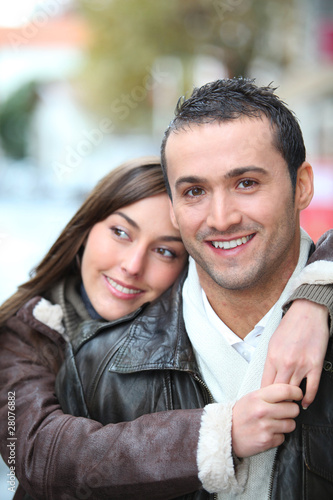 Young couple shopping in town in winter