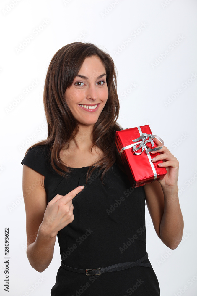 Smiling young woman with christmas gift Smiling young woman with christmas gift