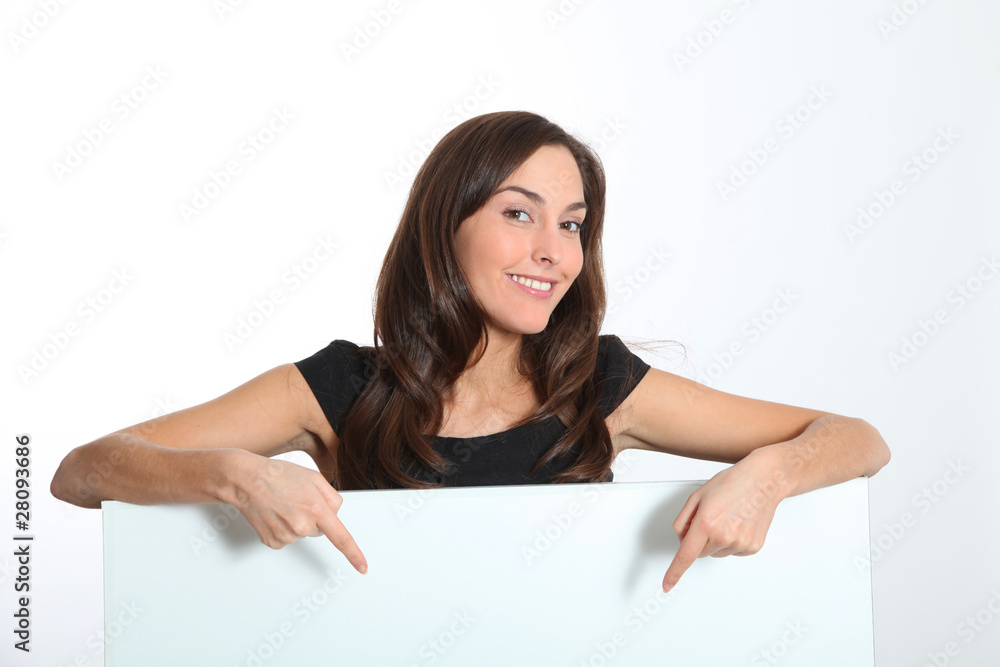 Woman in black dress showing message on white board Woman in black dress showing message on white board