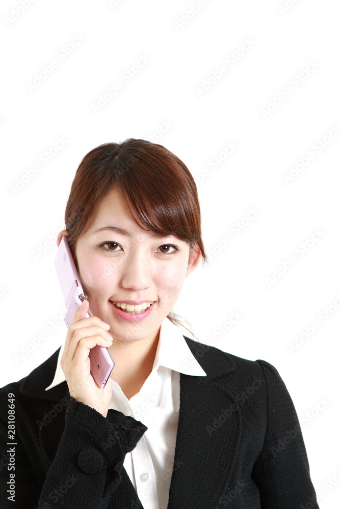buisiness woman talks with a mobilephone buisiness woman talks with a mobilephone