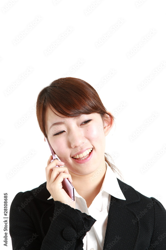 buisiness woman talks with a mobilephone buisiness woman talks with a mobilephone