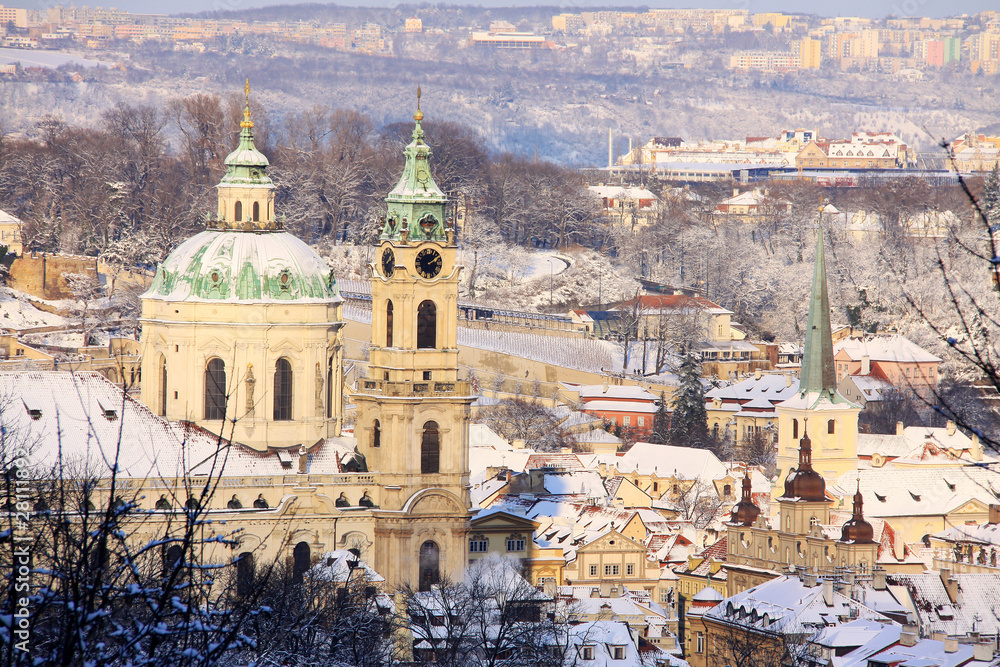 First Snow in Prague, St. Nicholas' Cathedral in the sunny Day