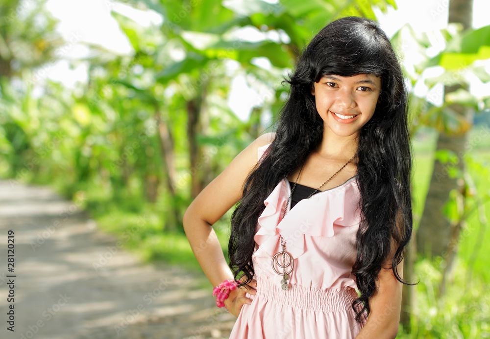 Portrait of young girl smiling in green nature Portrait of young girl smiling in green nature