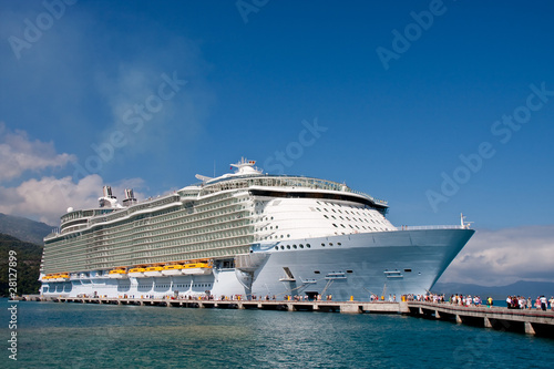 People disembarking a huge luxury cruise ship