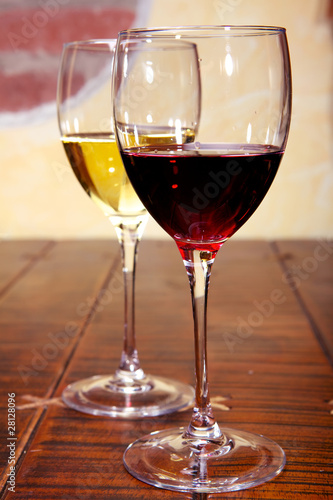 Glasses of red and white wine on a table