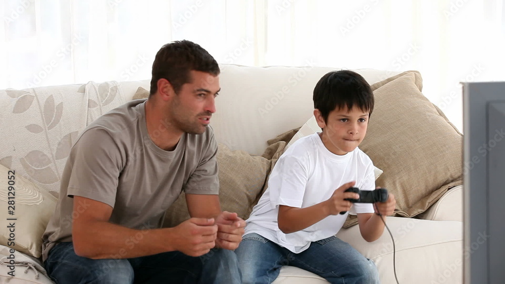 Father and his son playing together Father and his son playing together
