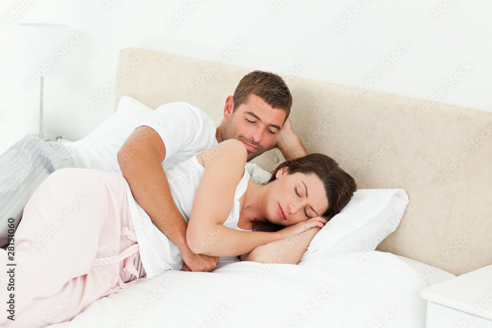 Passionate man looking at his girlfriend sleeping peacefully Passionate man looking at his girlfriend sleeping peacefully