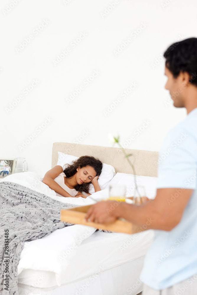 Fototapeta premium Adorable man bringing breakfast to his girlfriend