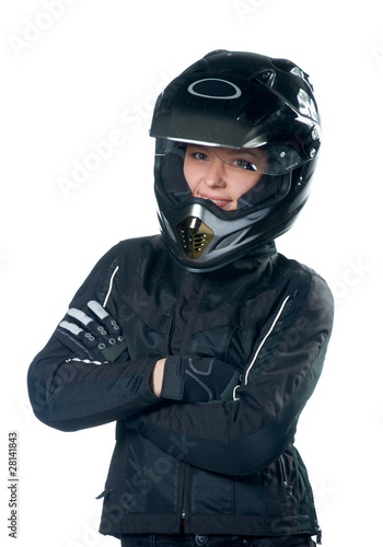 Young beauty woman posing in motorcycle clothing and helmet © Neiromobile