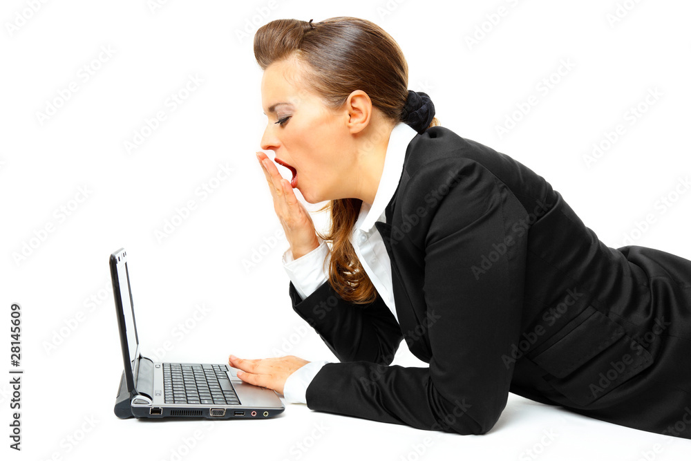 Laying on floor tired modern business woman working on laptop. Laying on floor tired modern business woman working on laptop.