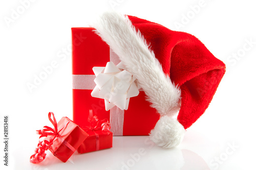 christmas presents and hat over white background photo