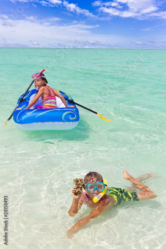 Children playing in ocean