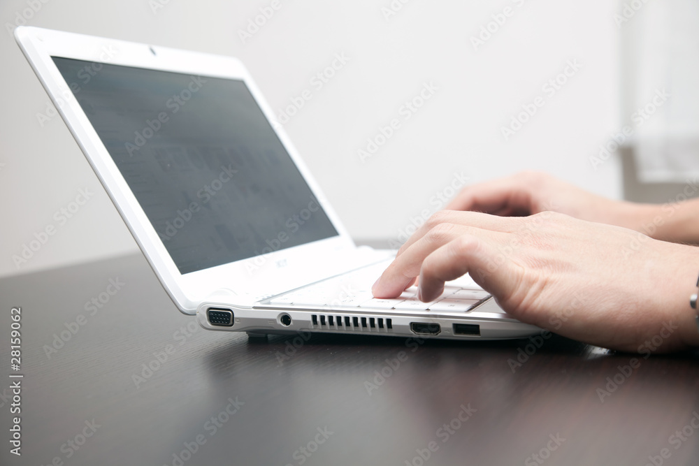Male hand working on the laptop Male hand working on the laptop