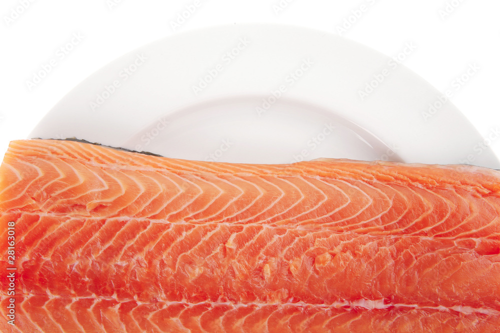 big salmon fillet on white plate big salmon fillet on white plate