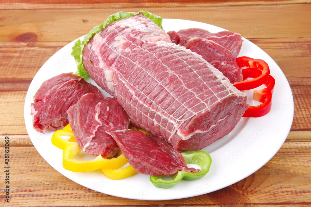 uncooked meat with vegetables