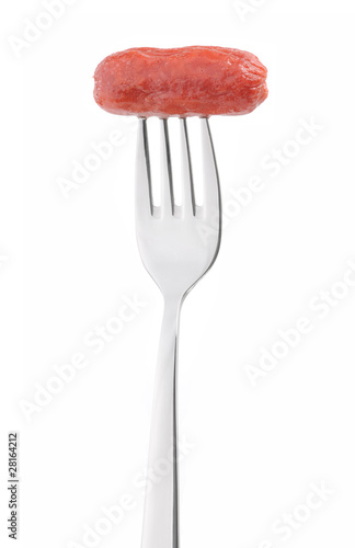 Fried sausage on a fork isolated on white background.