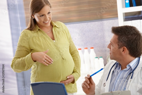Expectant woman at doctor