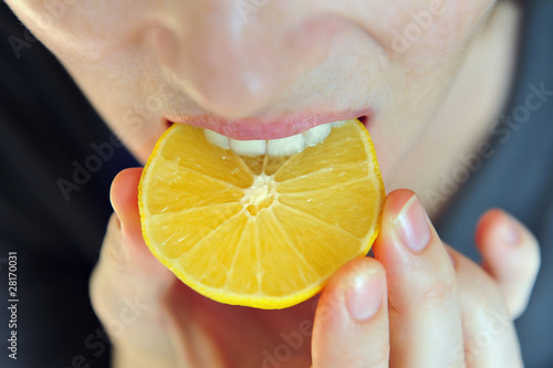 Girl Eats Sour Lemon photo