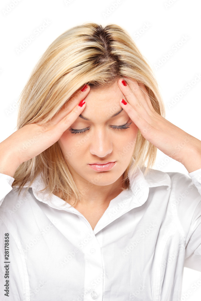 Blonde woman having a headache and holding her head Blonde woman having a headache and holding her head