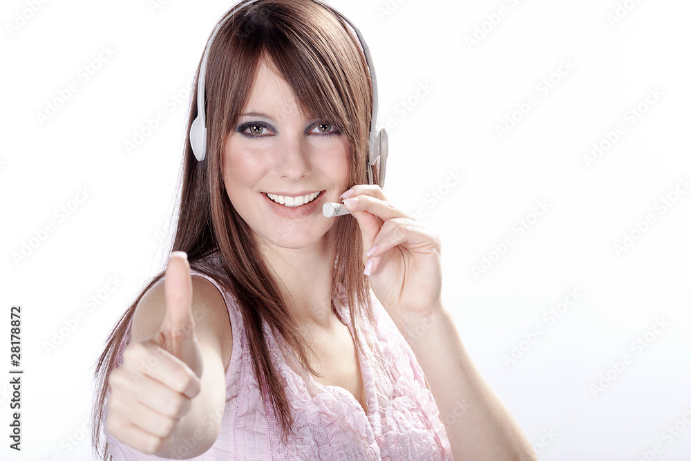 Junge Frau telefoniert mit Head Set und Daumen hoch Porträt Junge Frau telefoniert mit Head Set und Daumen hoch Porträt