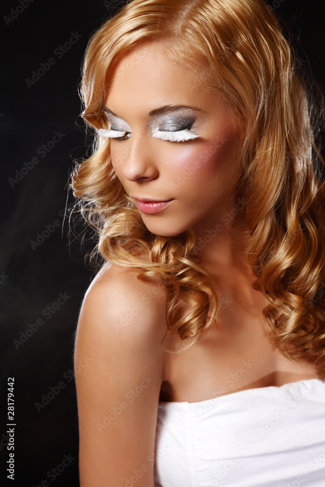 portrait of a beautiful young woman with extreme make up