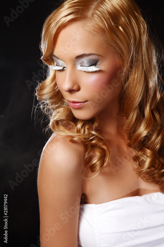 portrait of a beautiful young woman with extreme make up