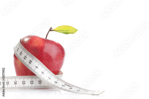 Red fresh apple with tape on white background
