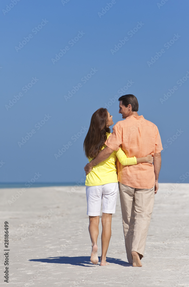 Romantic Happy Couple Walking on A Beach Romantic Happy Couple Walking on A Beach