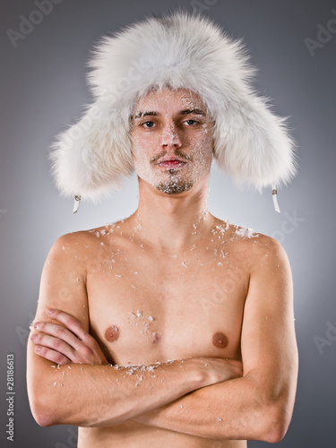 Young man with which face covered with hoarfrost