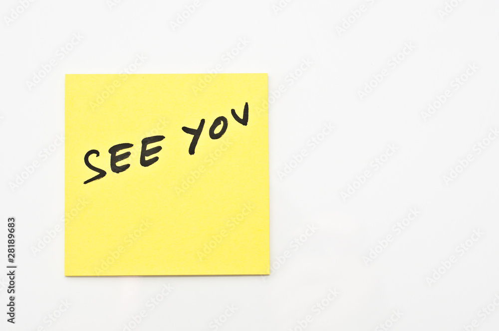 Yellow square Post it with See you written on it Yellow square Post it with See you written on it