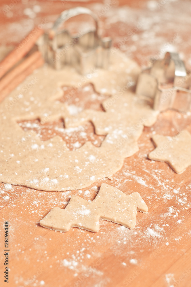 Christmas baking background: dough, cookie cutters and spices Christmas baking background: dough, cookie cutters and spices