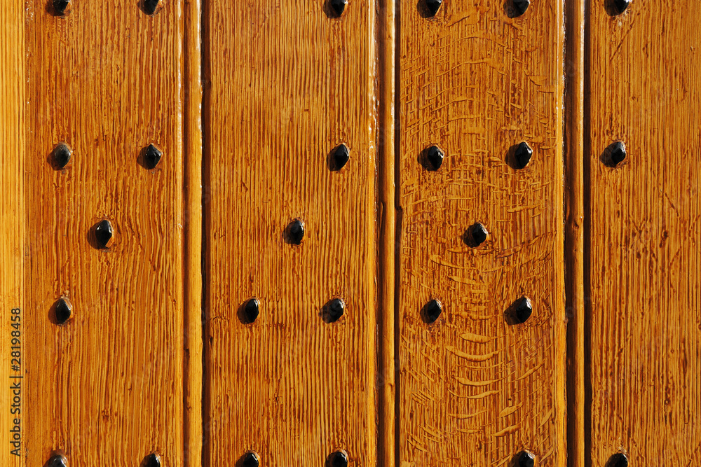 Durable castle wooden gate with forged iron bolt heads Durable castle wooden gate with forged iron bolt heads