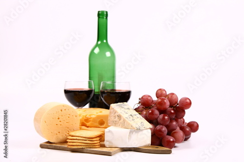 Various types of cheese adn white wine