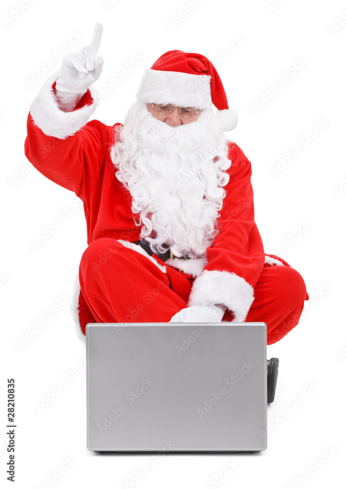 Surprised Santa claus and laptop on white Surprised Santa claus and laptop on white