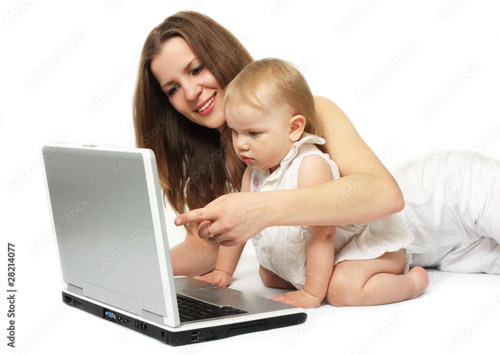 beautiful mother with daughter looking on the laptop beautiful mother with daughter looking on the laptop