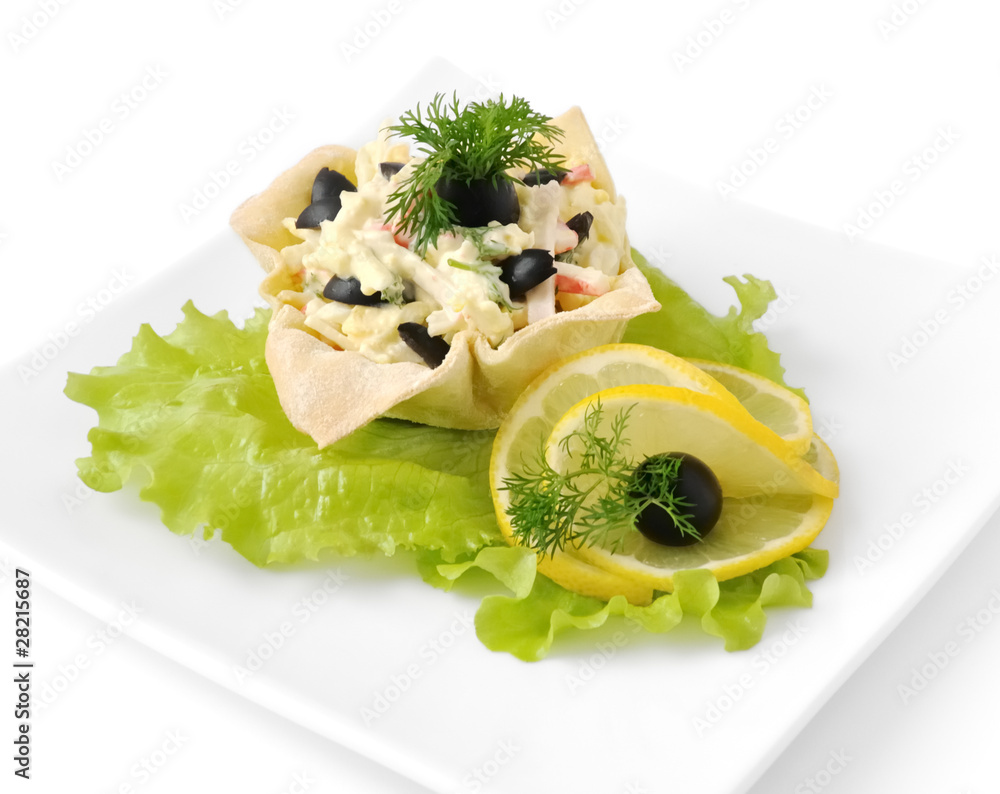 Salad with crab meat in a basket Salad with crab meat in a basket