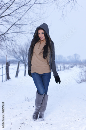 Georgeous woman standing on snowy outdoor