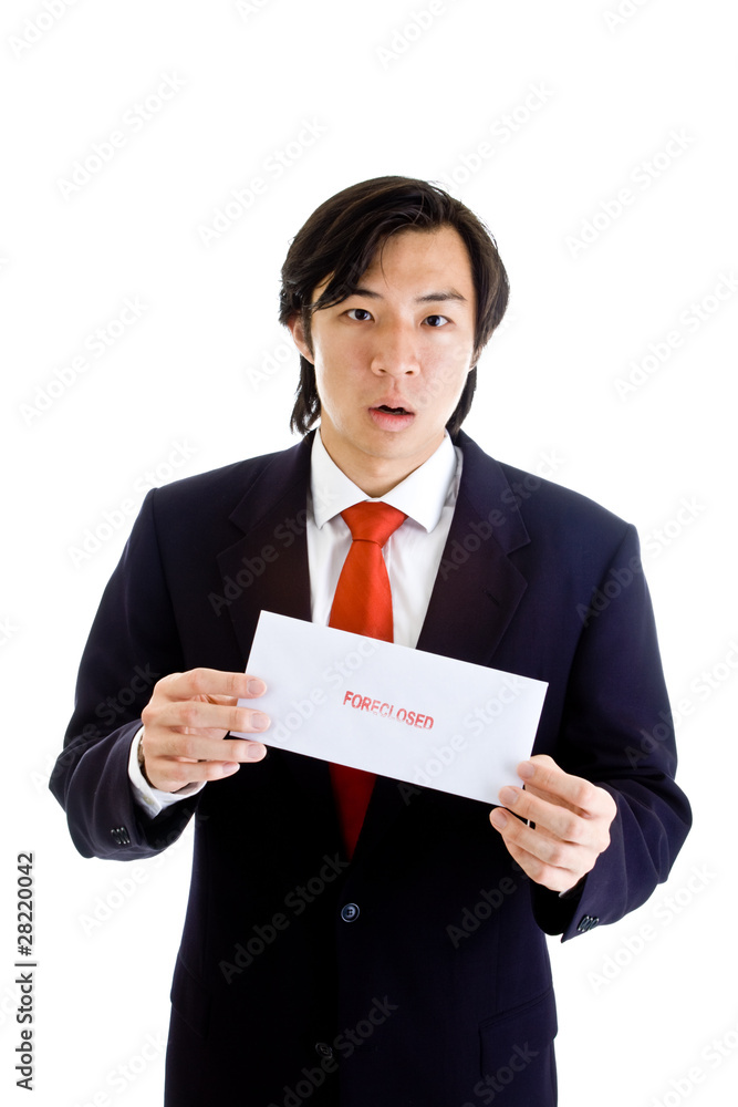 Shocked Asian Man Holding Foreclosure Notice Isolated on White Shocked Asian Man Holding Foreclosure Notice Isolated on White