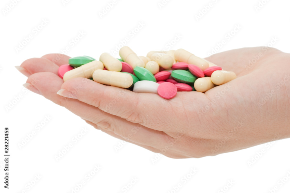 Hand with a pill on white background Hand with a pill on white background