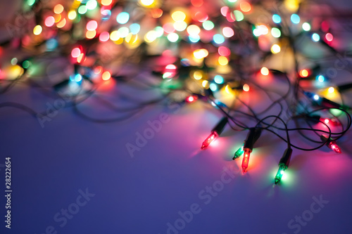 Christmas lights on dark blue background with copy space. Decora